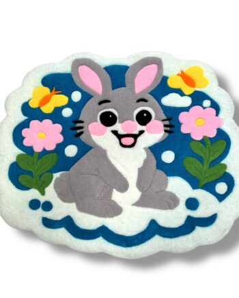 Front view of handmade tufted rabbit rug for kids showing full bunny design and bright, detailed tufting.