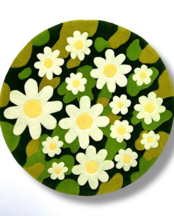Handmade tufted chamomile moss rug in green with white flower details