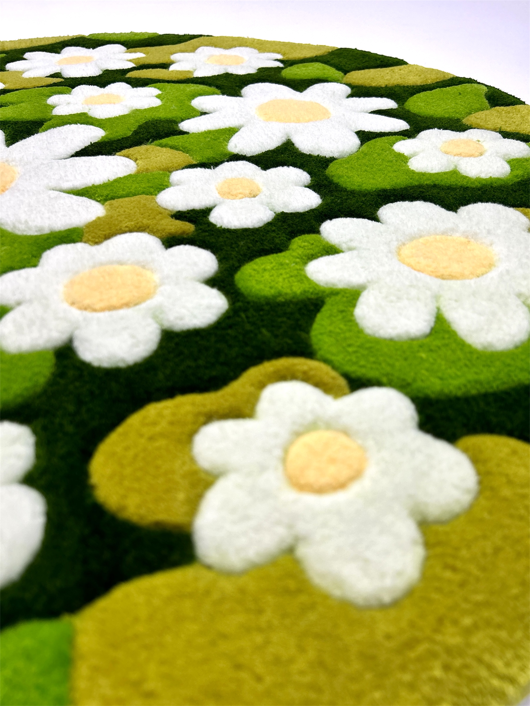 Close-up texture of acrylic yarn on handmade chamomile moss rug
