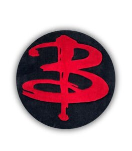 Primary product photo showing a custom hand-tufted Buffy logo rug
