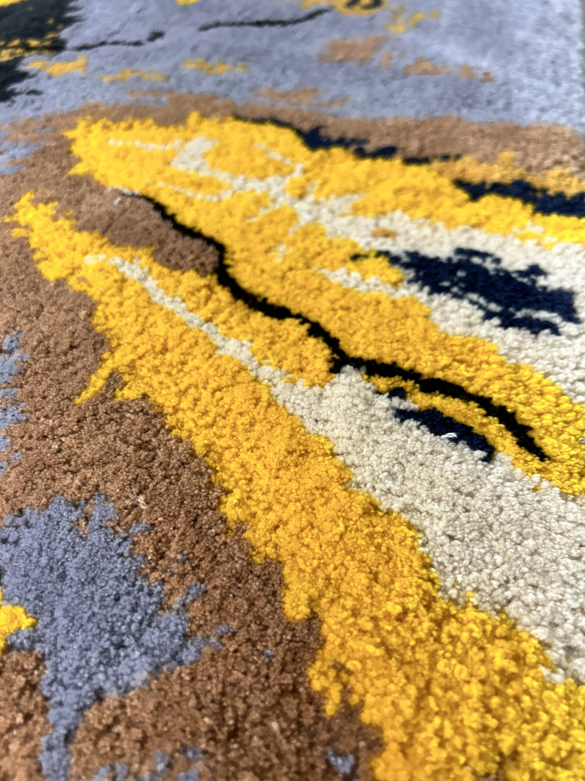 Handmade tufted rug abstract art detailed view